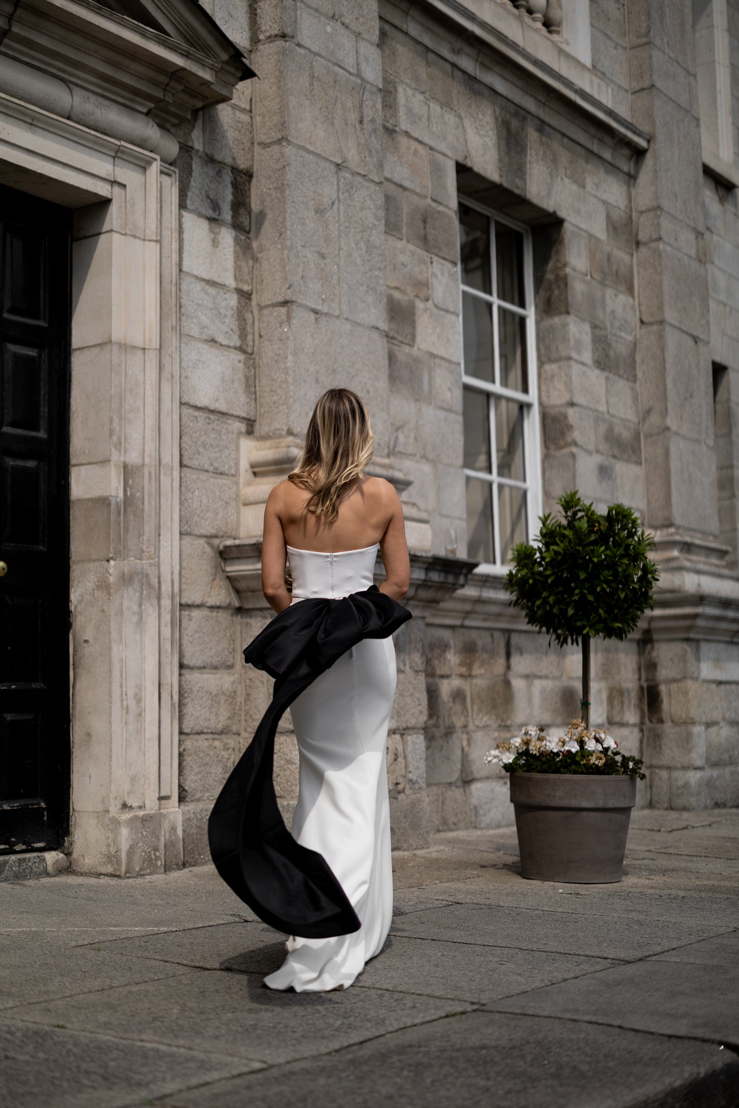 Irish bride with oversized statement black organza bow