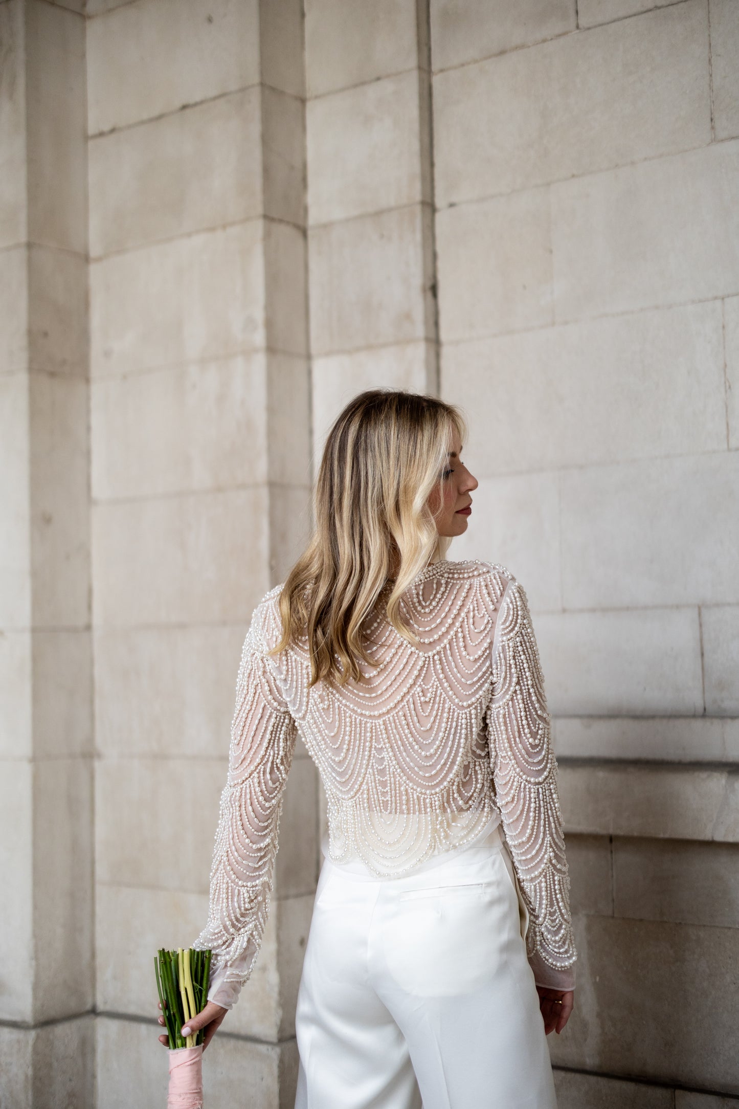 Irish bride wears hand beaded bridal top with sleeves in Cork