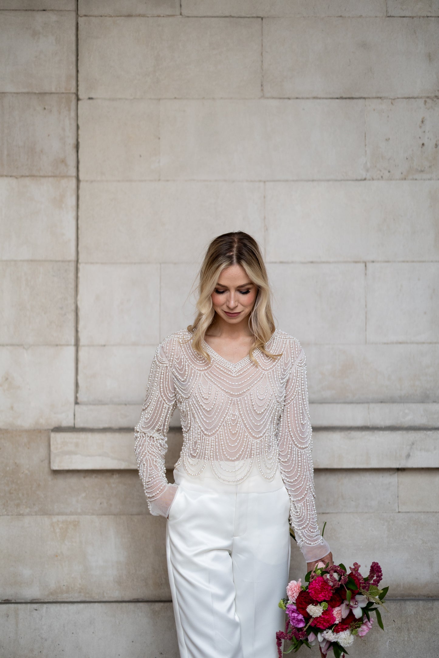 Irish bride wears hand beaded bridal top with sleeves in Cork