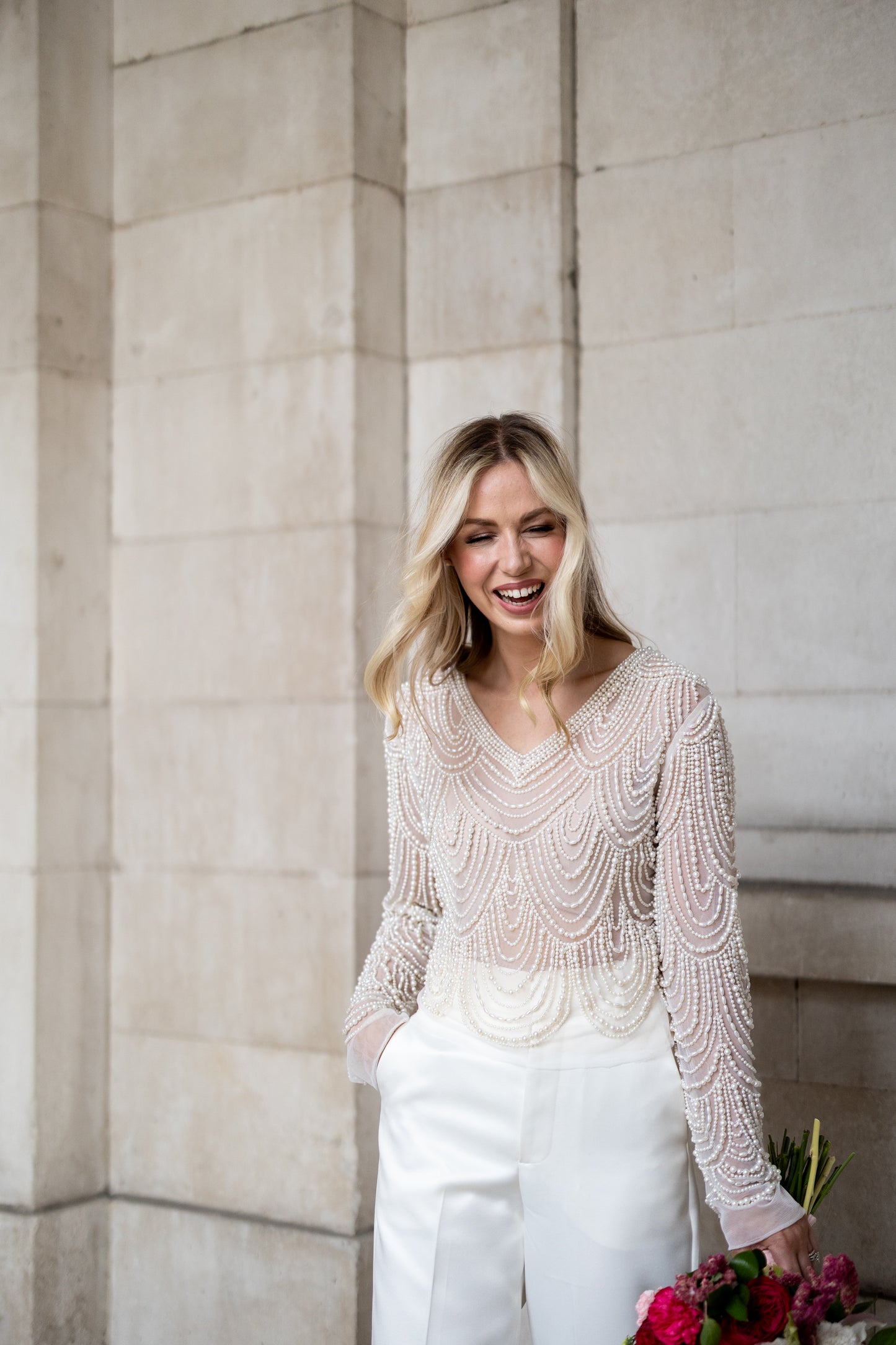 Irish bride wears hand beaded bridal top with sleeves in Cork