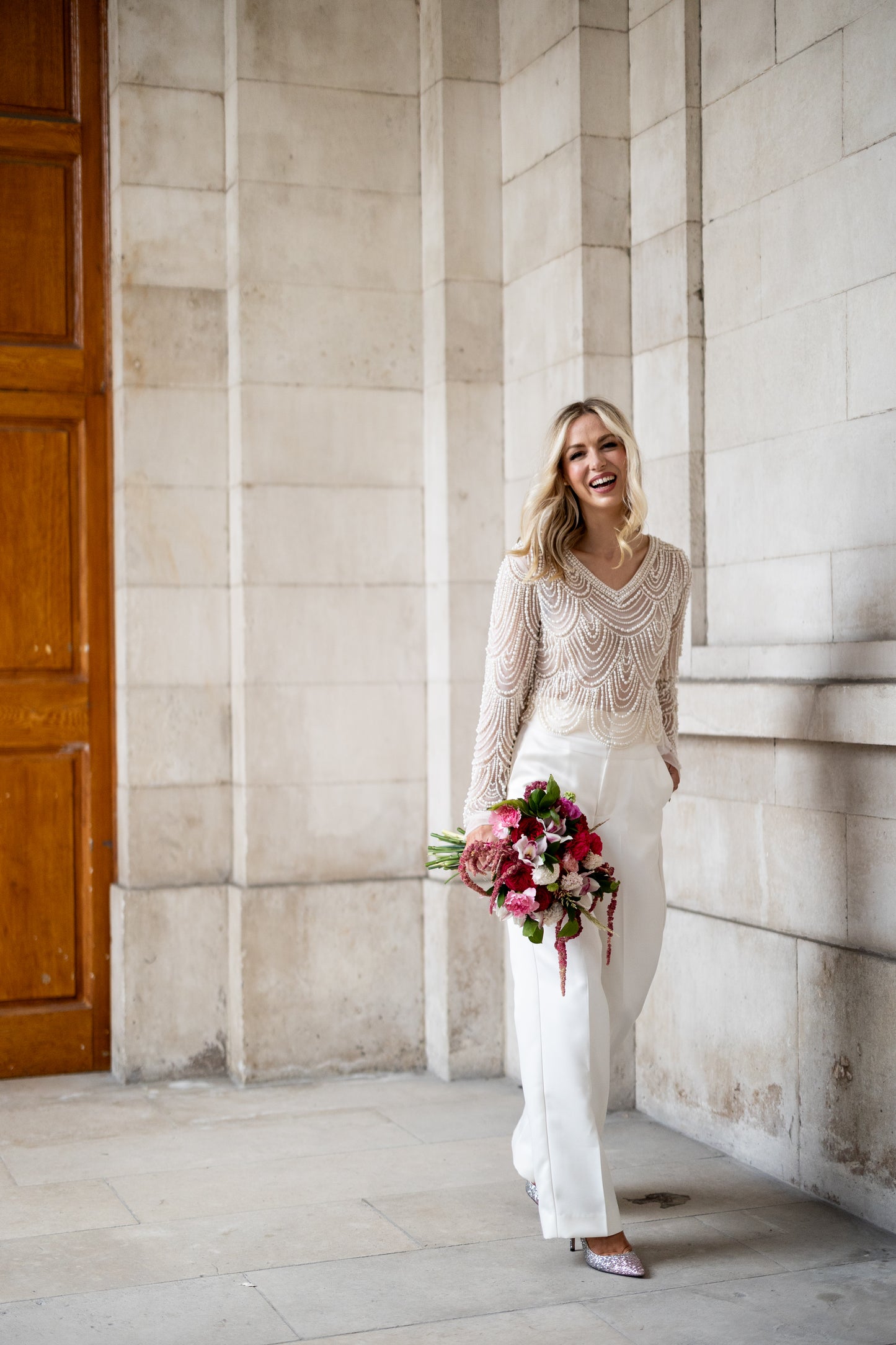 Irish bride wears hand beaded bridal top with sleeves in Cork