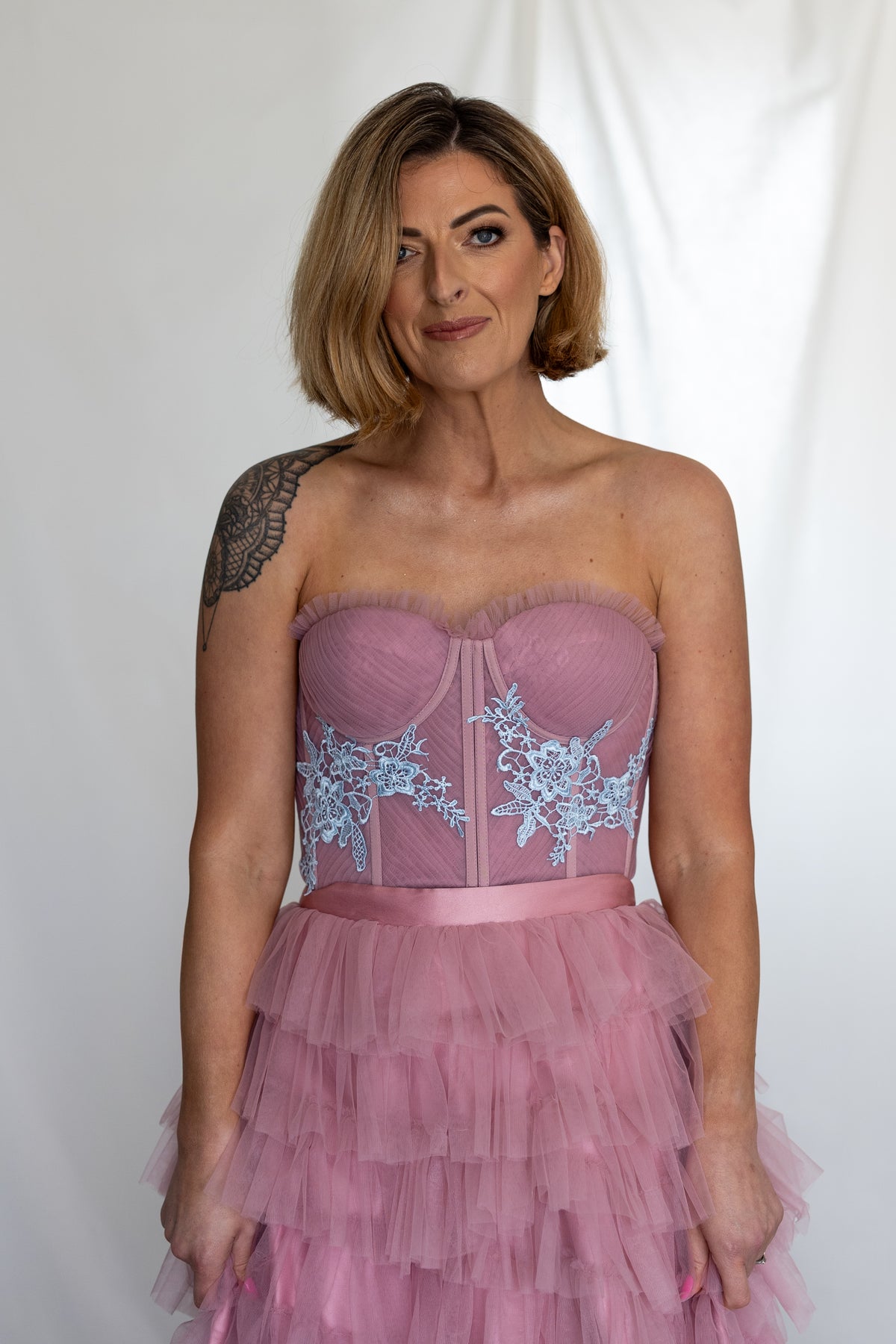 Close-up of the Carrie Co-ord's dusty pink strapless corset with blue lace flowers and satin waistband – Mizz Rio