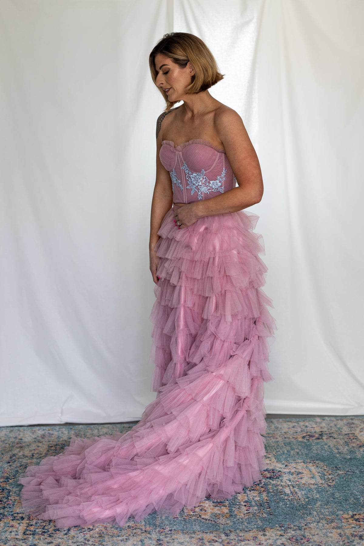 Side view of the Carrie Co-ord's tiered dusty pink tulle skirt trailing behind – Mizz Rio alternative bridal