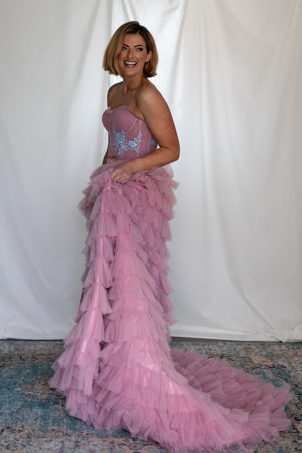 Side view of the Carrie Co-ord showing the long pink ruffle train – Mizz Rio alternative wedding separates