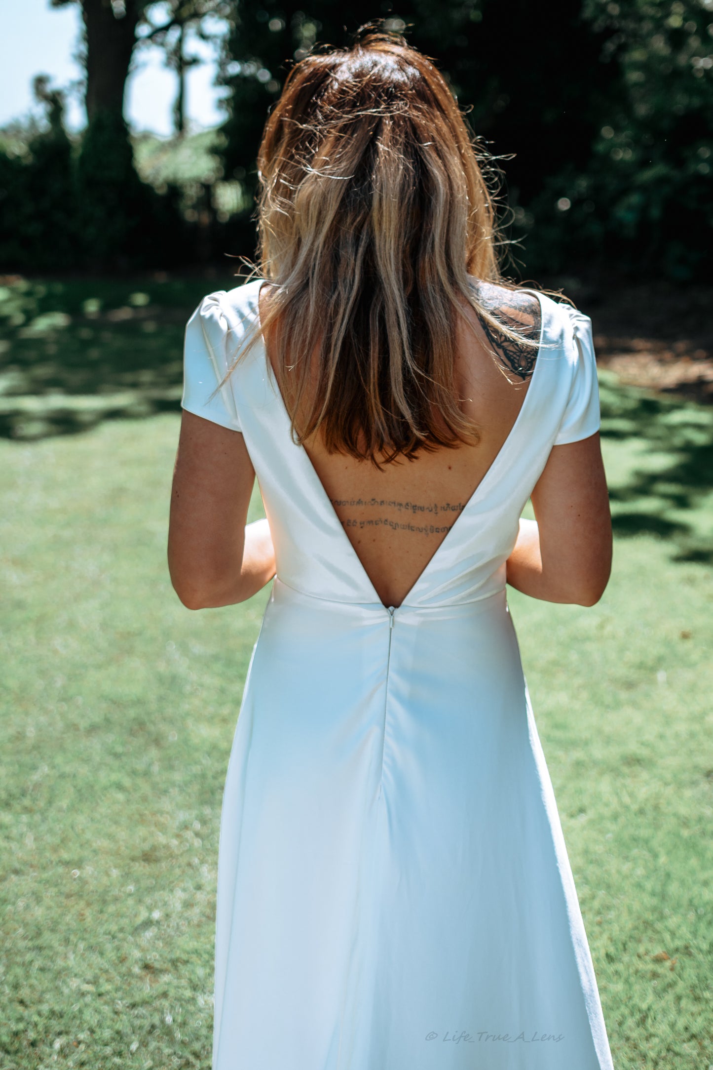 Irish bride wears a minimalist wedding dress with cap sleeves in Cork 