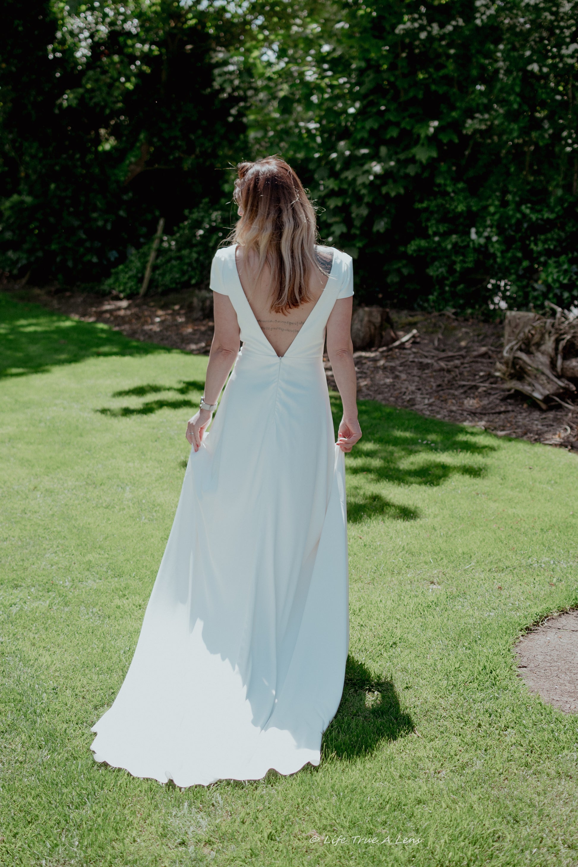 Irish bride wears a minimalist wedding dress with cap sleeves in Cork 