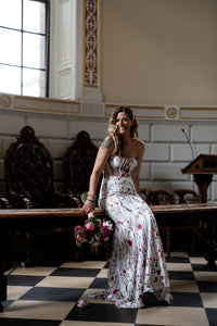 Irish bride wearing a floral wedding dress with pink and blue flowers in Ireland.