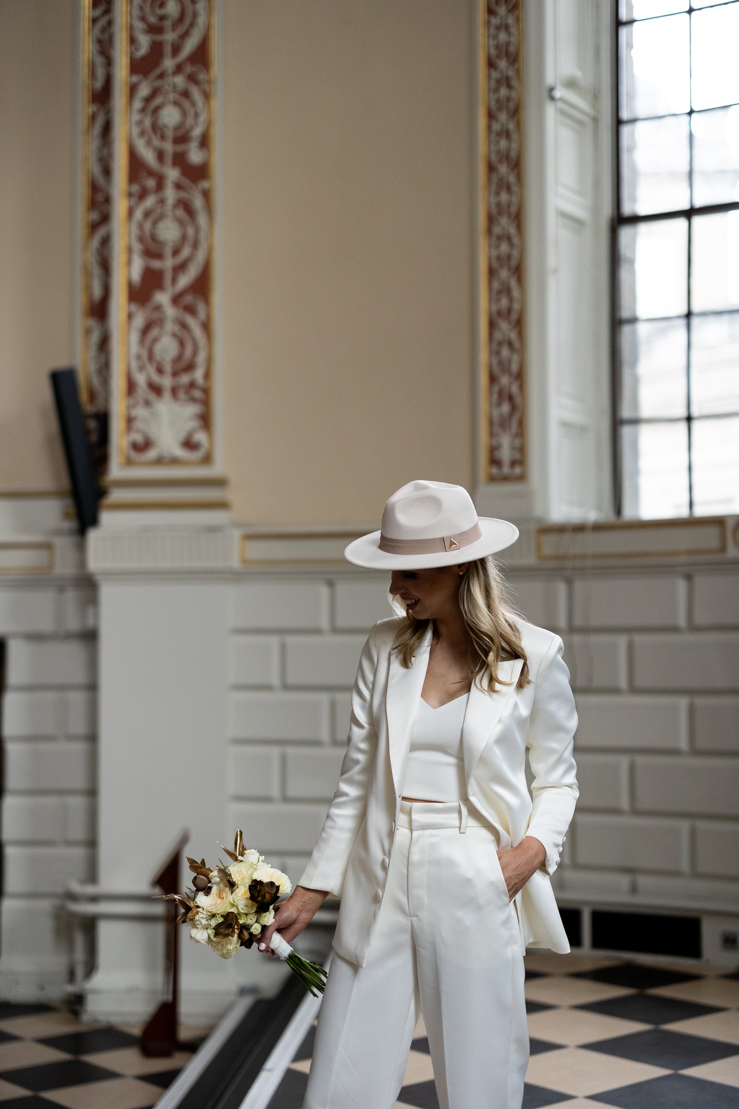 Irish bride wearing tuxedo style jacket and trousers in Ireland 