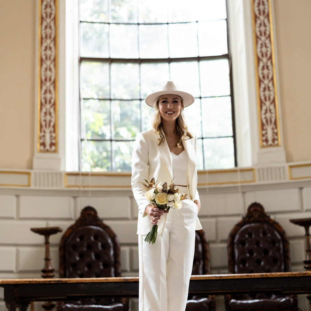 Irish bride wearing tuxedo style jacket and trousers in Ireland 