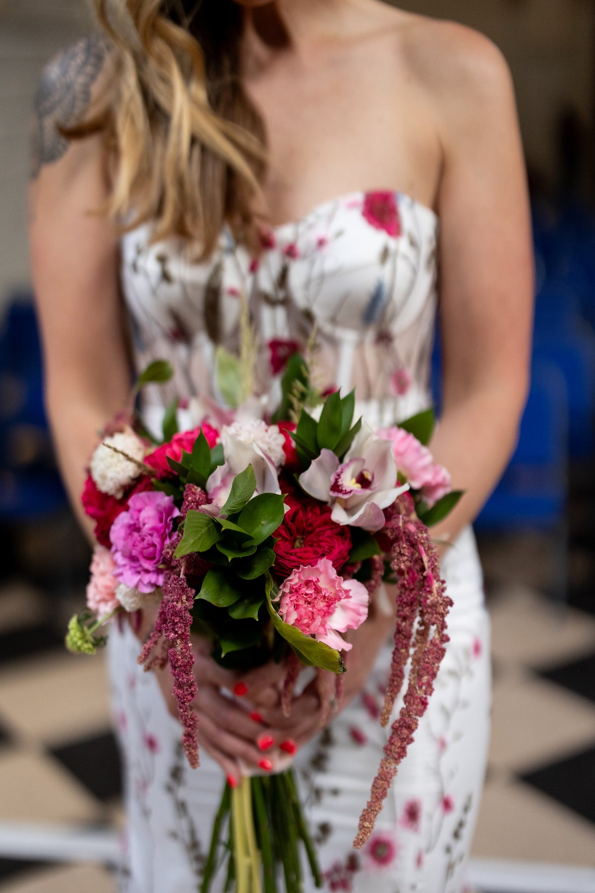 Irish bride wearing a floral wedding dress with pink and blue flowers in Ireland.