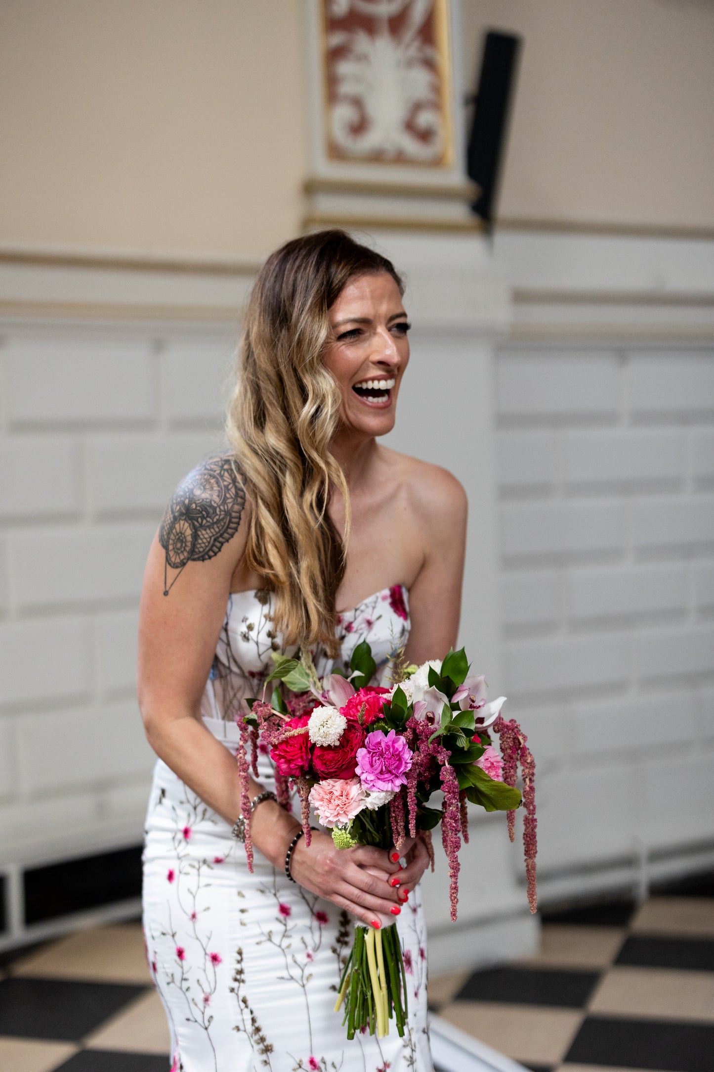 Irish bride wearing a floral wedding dress with pink and blue flowers in Ireland.