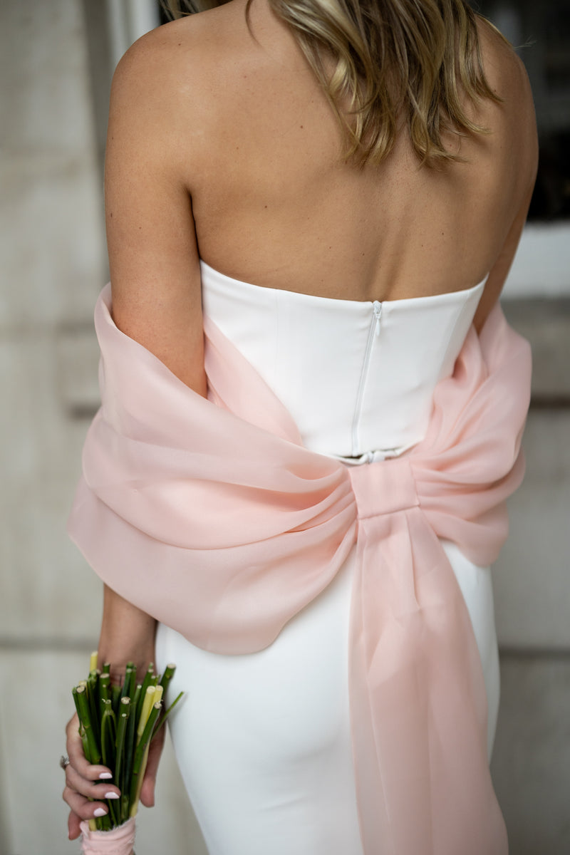 Irish bride wearing a wedding dress and statement pink bow in Dublin. 