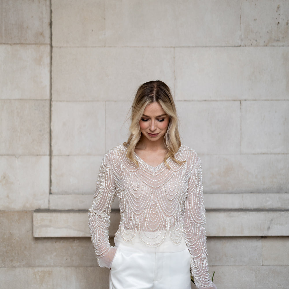 Irish bride wears hand beaded bridal top with sleeves in Cork 