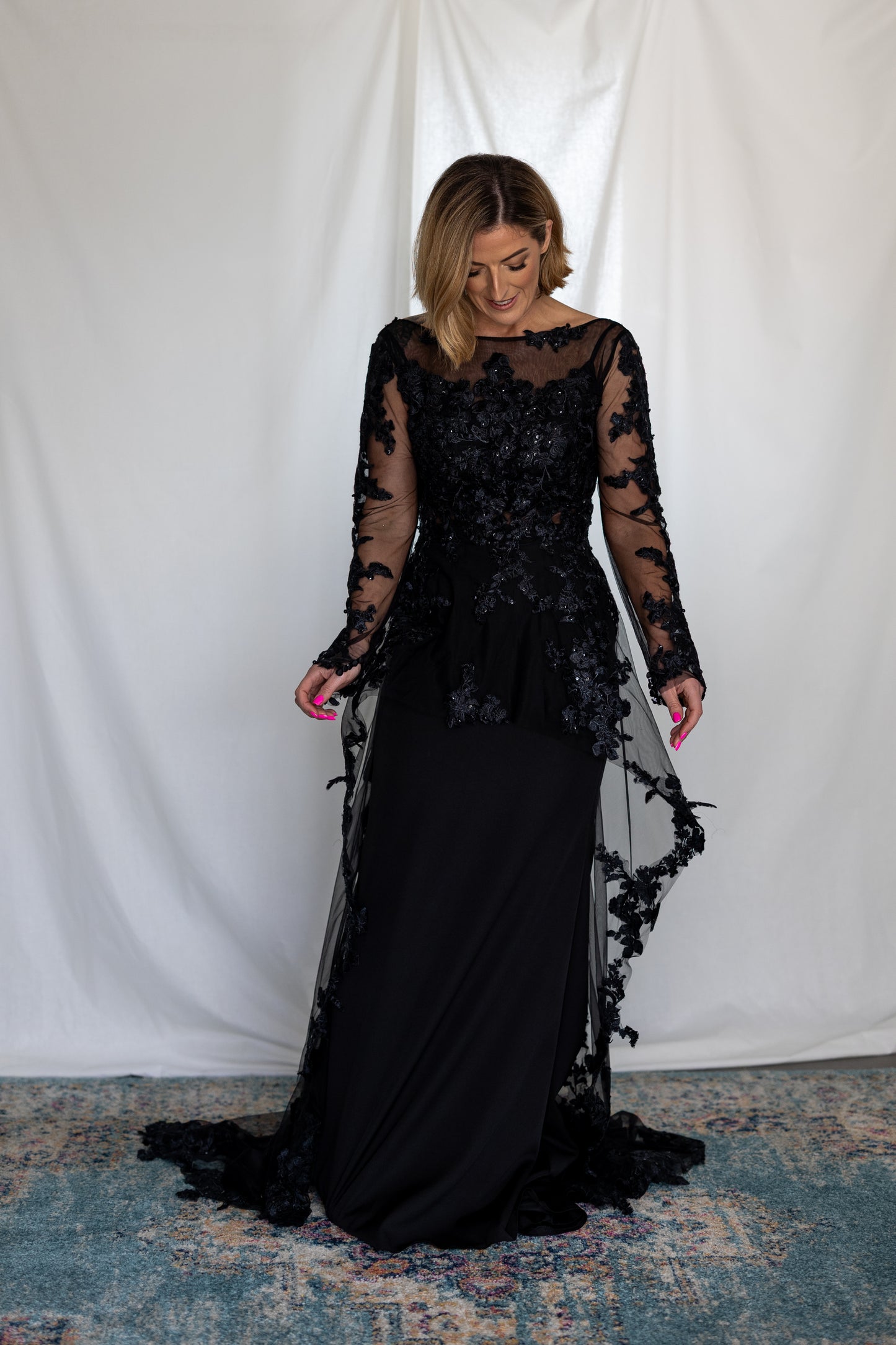 Black lace wedding dress with long sheer sleeves and 3D appliqué — modern alternative bridal gown handcrafted by Irish designer Mizz Rio in ireland