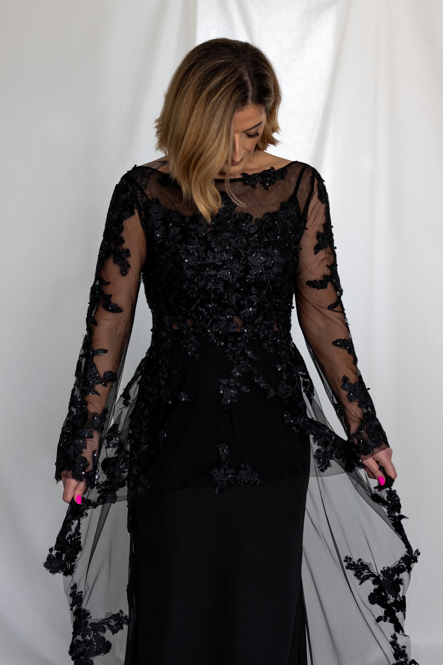 Black lace wedding dress with long sheer sleeves and 3D appliqué — modern alternative bridal gown handcrafted by Irish designer Mizz Rio in ireland