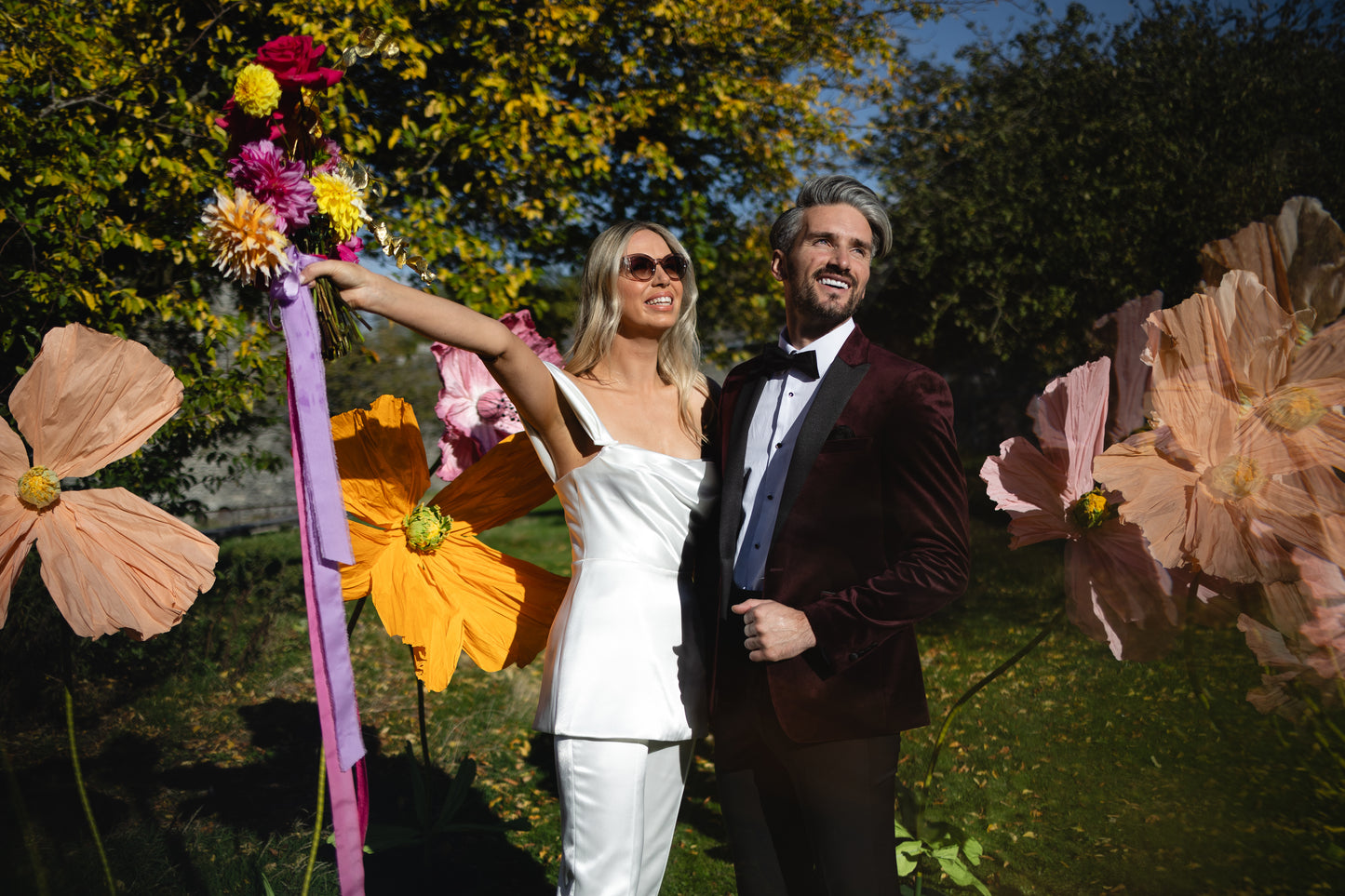 Modern satin bridal jumpsuit with draped bodice and tailored trousers – contemporary alternative wedding look by Mizz Rio