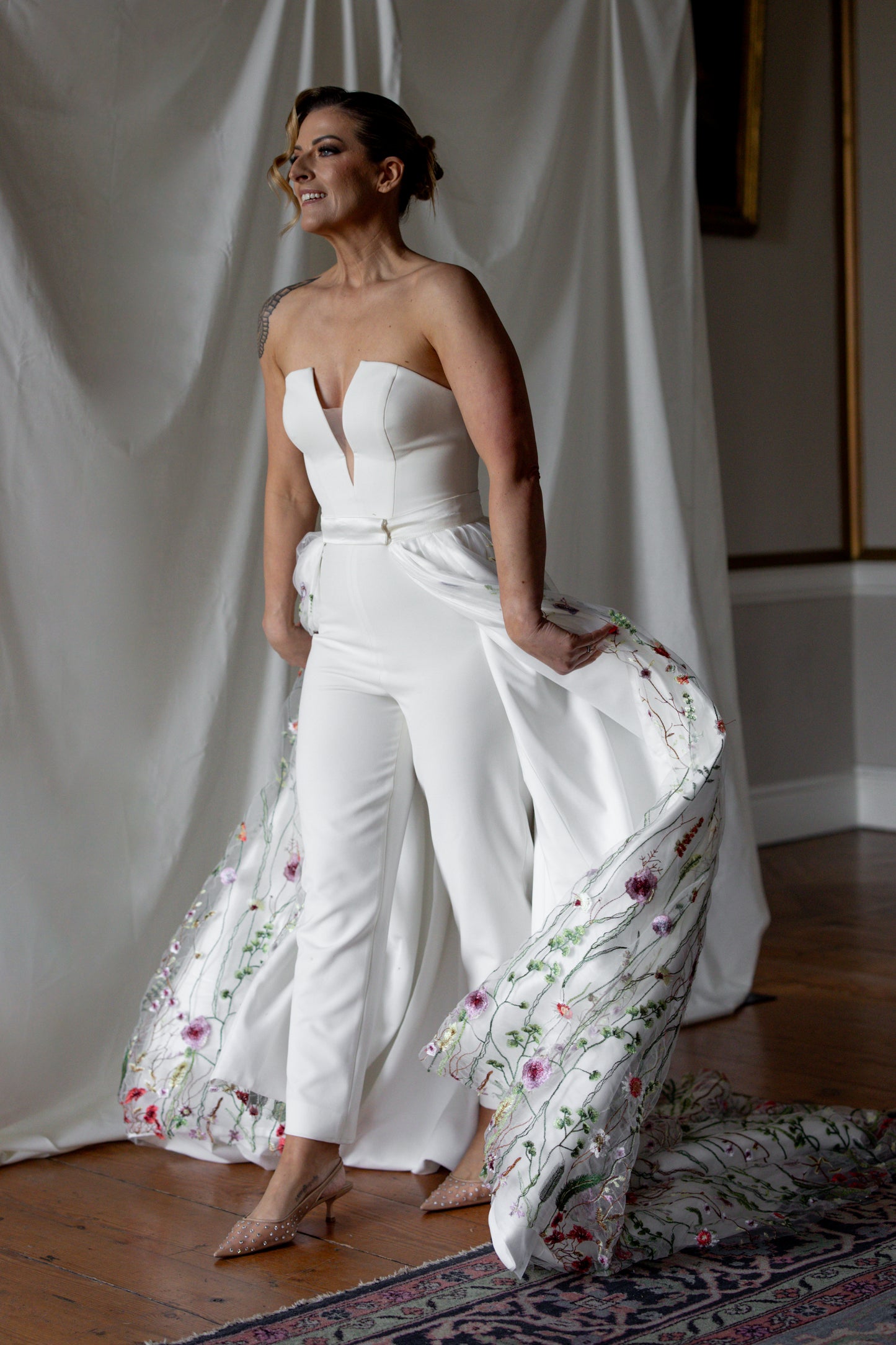 Floral embroidered wedding overskirt with multicoloured botanical lace detailing, styled over a strapless satin bridal gown — modern couture by Mizz Rio in Ireland 