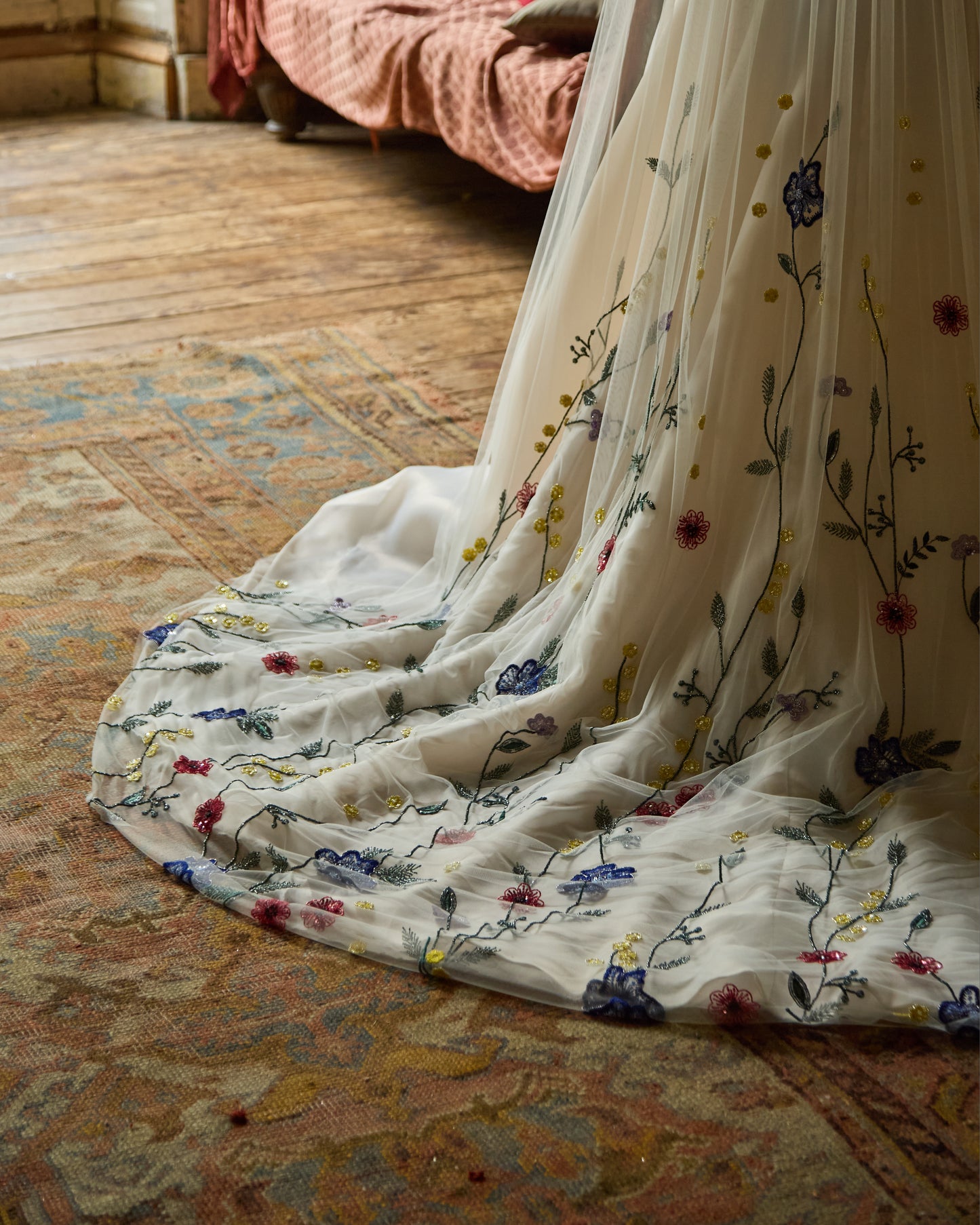 Couture bridal veil hand-embroidered with colourful Irish wildflowers, worn by modern bride in minimalist ivory wedding dress, designed by Mizz Rio in Dublin