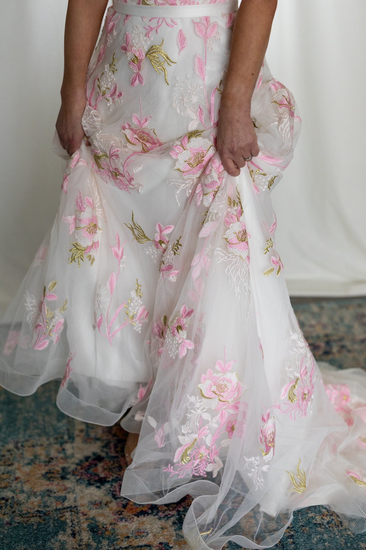Pink floral embroidered wedding dress with sheer flutter sleeves and layered tulle skirt — modern romantic alternative bridal gown by Mizz Rio in Ireland 