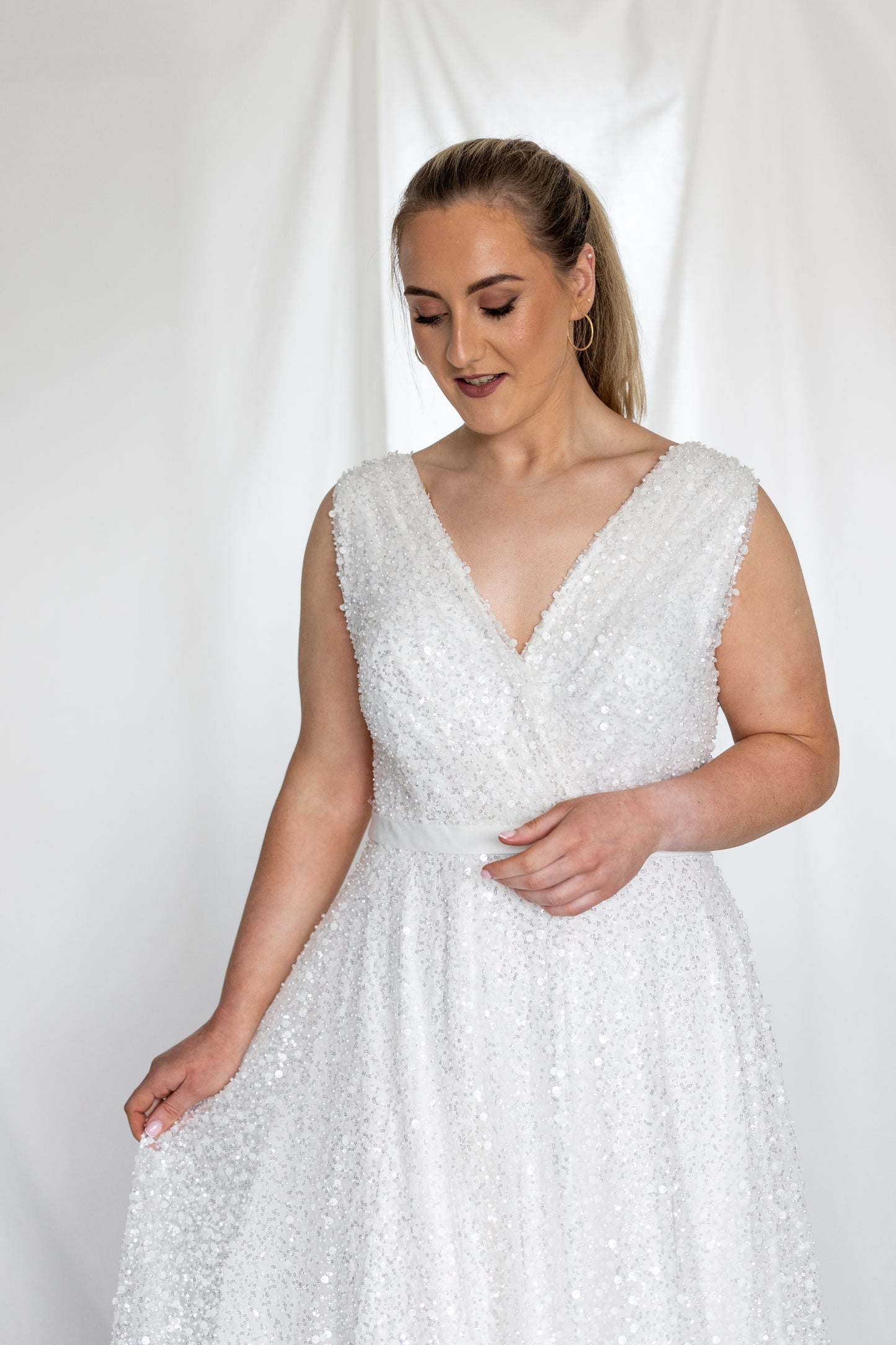 Sequined A-line wedding dress with deep V-neckline and soft sparkle, modern bridal gown by Mizz Rio Couture ireland