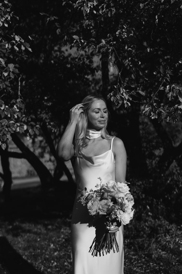 Bride in a modern Mizz Rio bridal outfit