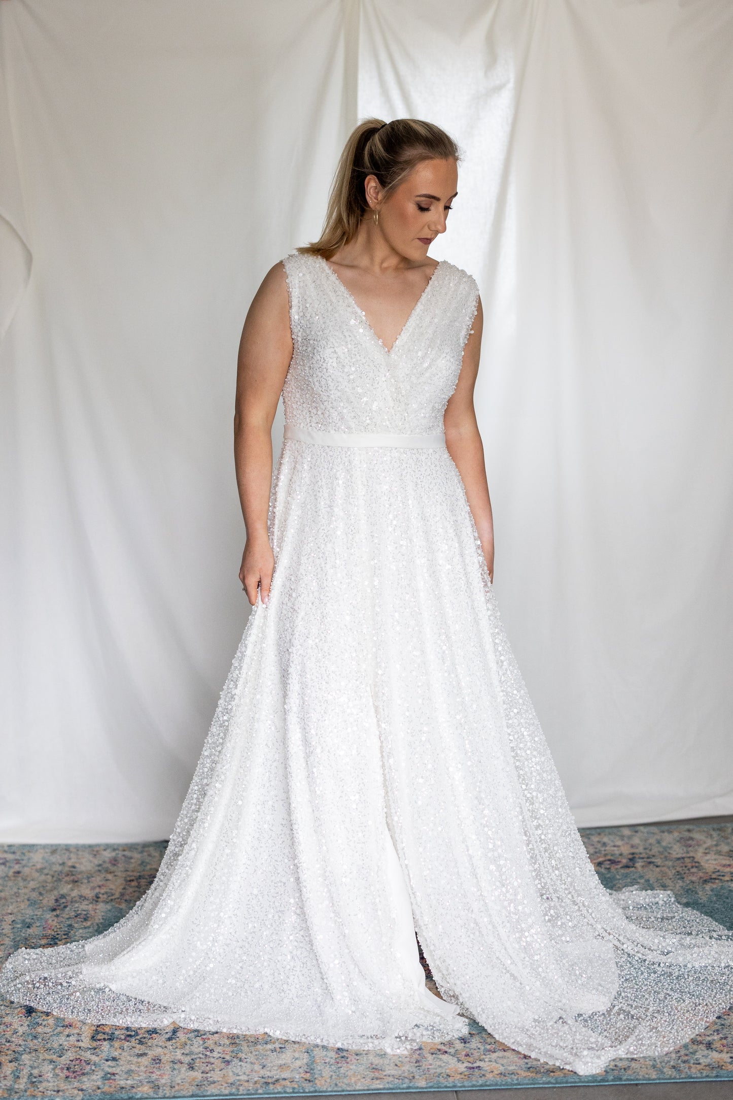 Sequined A-line wedding dress with deep V-neckline and soft sparkle, modern bridal gown by Mizz Rio Couture ireland