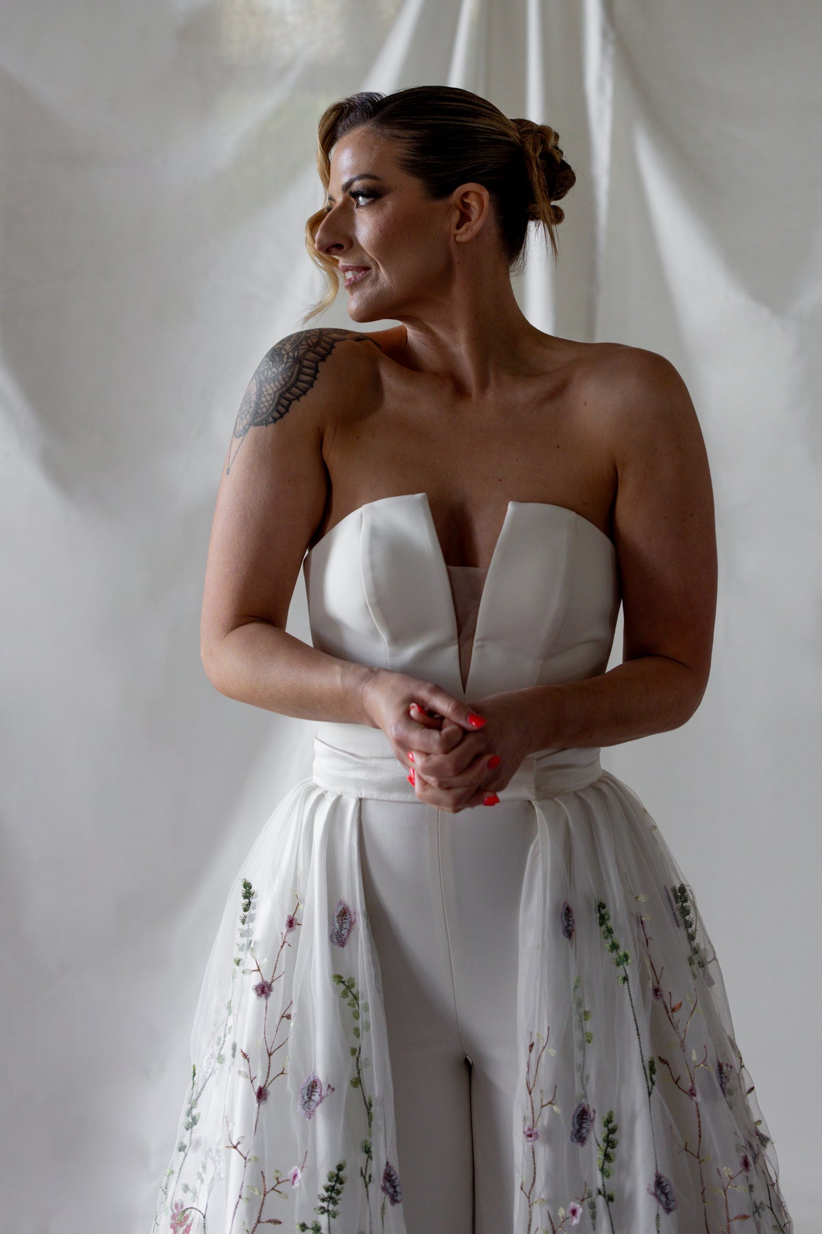 Floral embroidered wedding overskirt with multicoloured botanical lace detailing, styled over a strapless satin bridal gown — modern couture by Mizz Rio in Ireland 