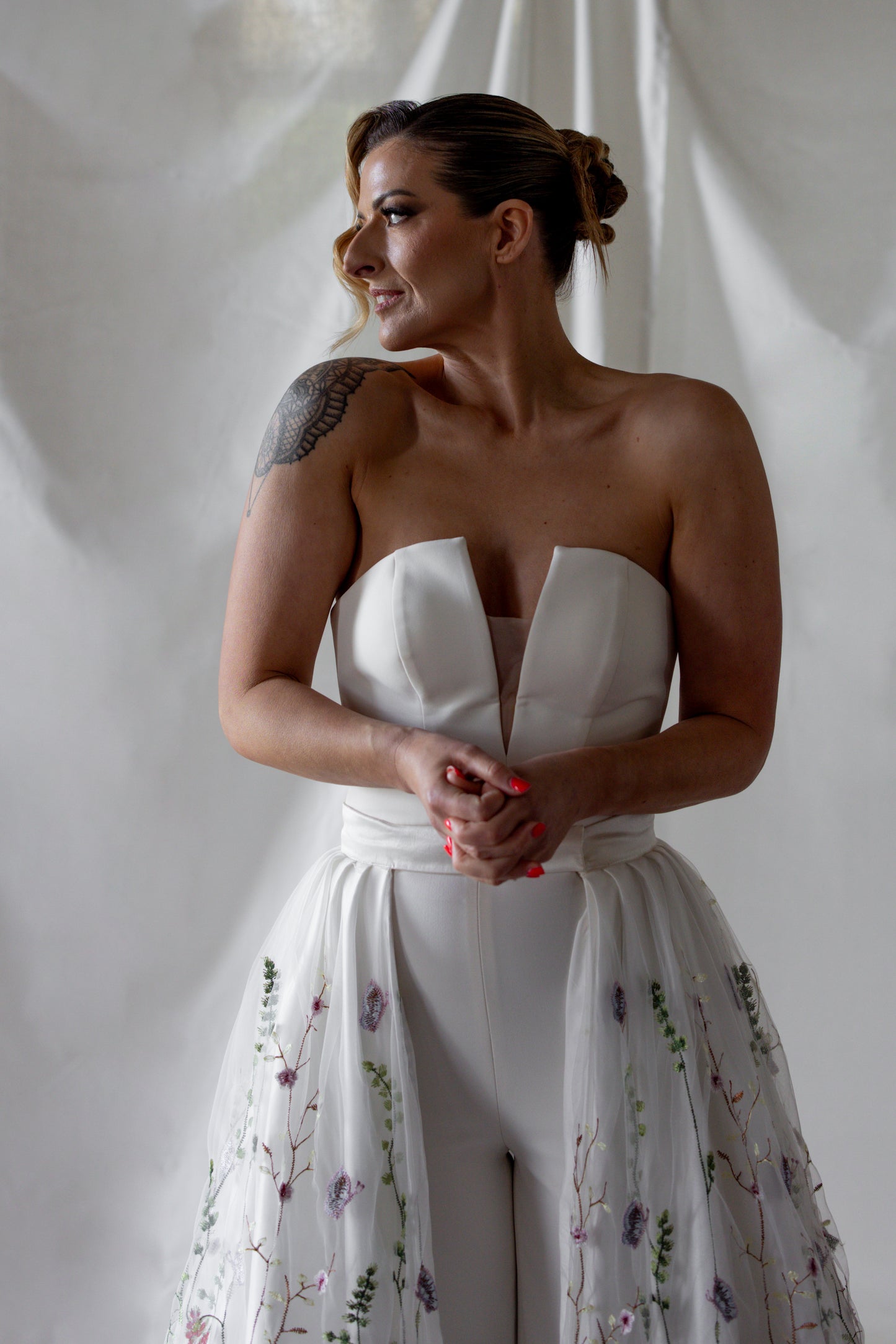 Floral embroidered wedding overskirt with multicoloured botanical lace detailing, styled over a strapless satin bridal gown — modern couture by Mizz Rio in Ireland 