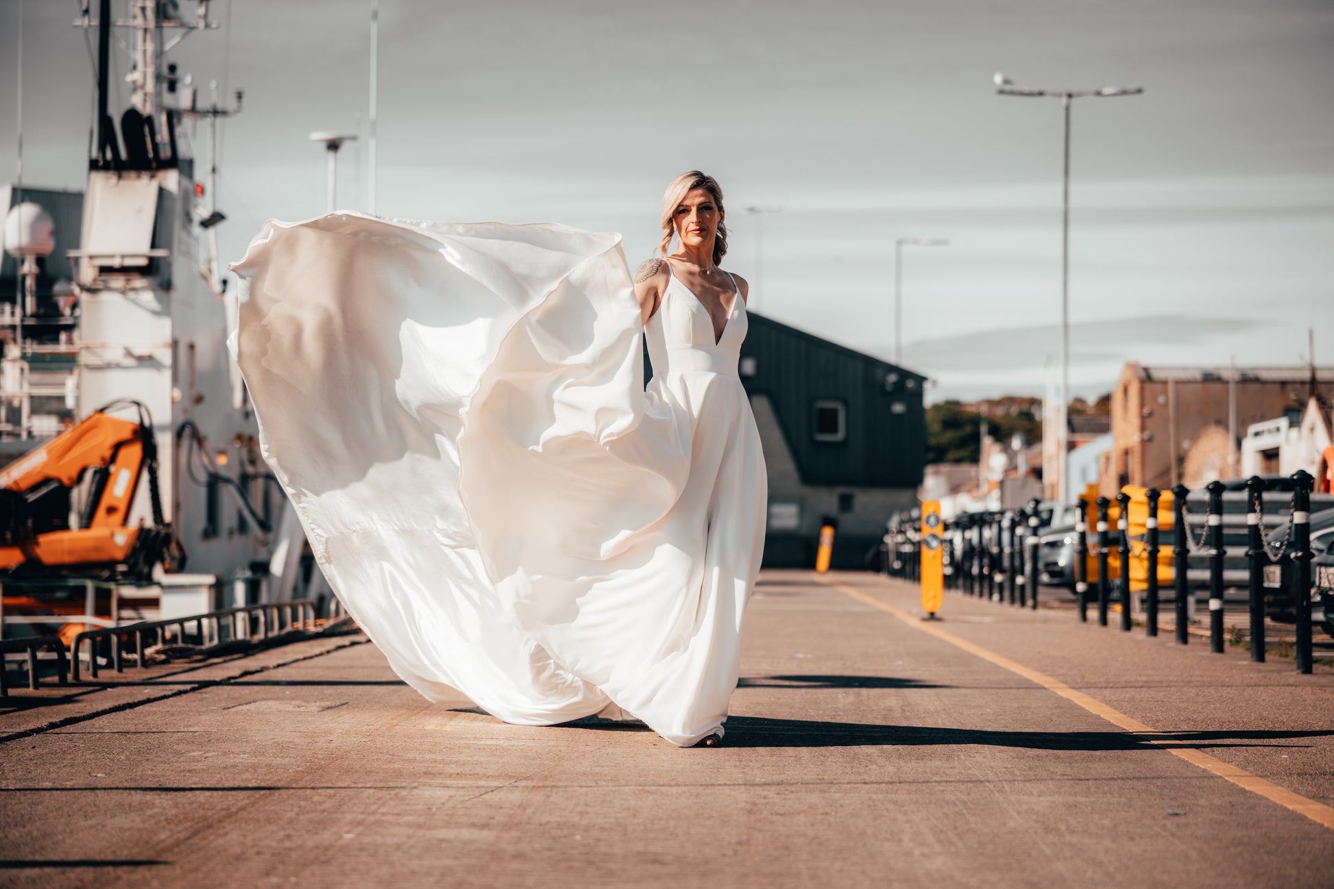 Irish bride in minimal wedding dress with pockets walking in Dublin 