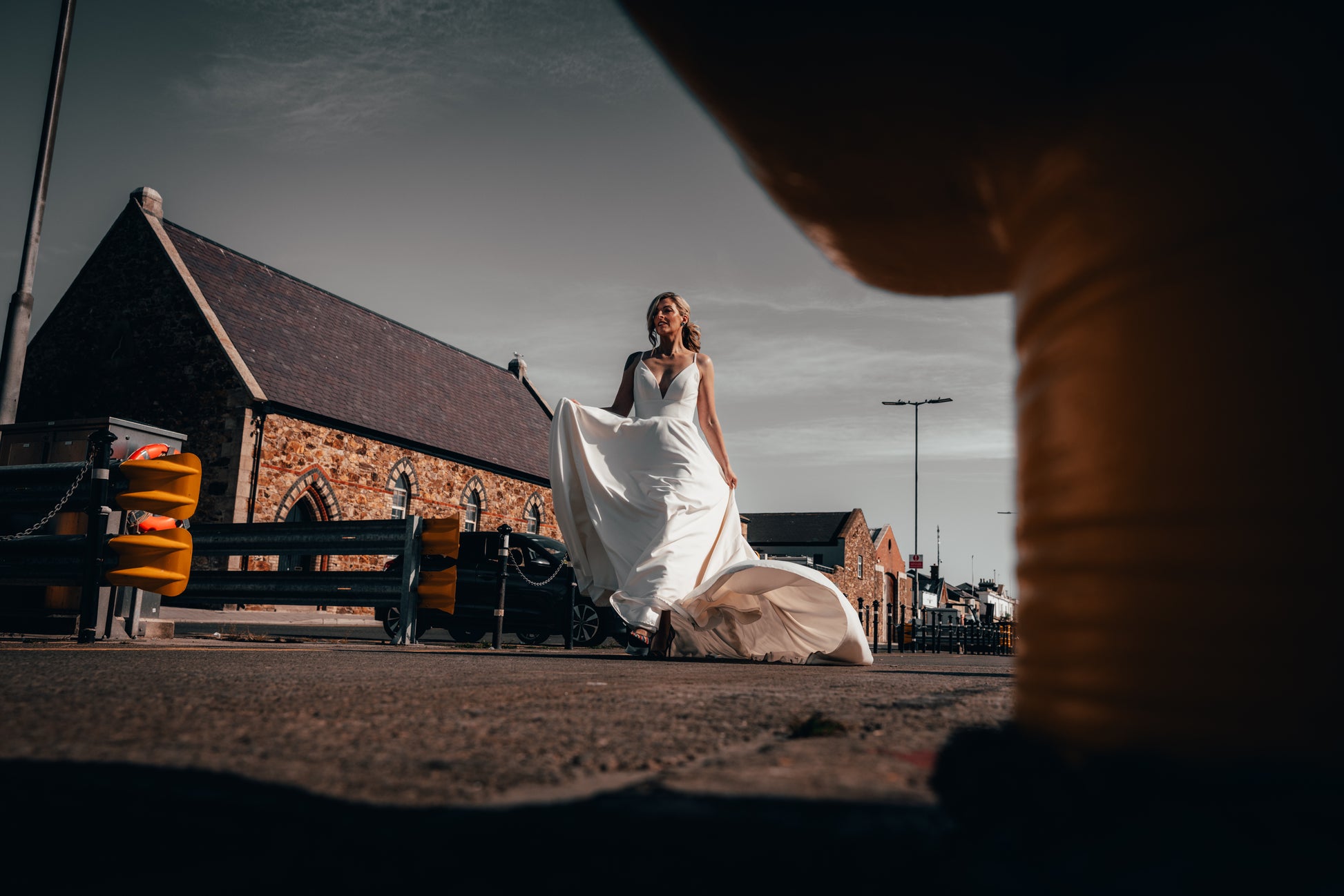 Irish bride in minimal wedding dress with pockets walking in Dublin 