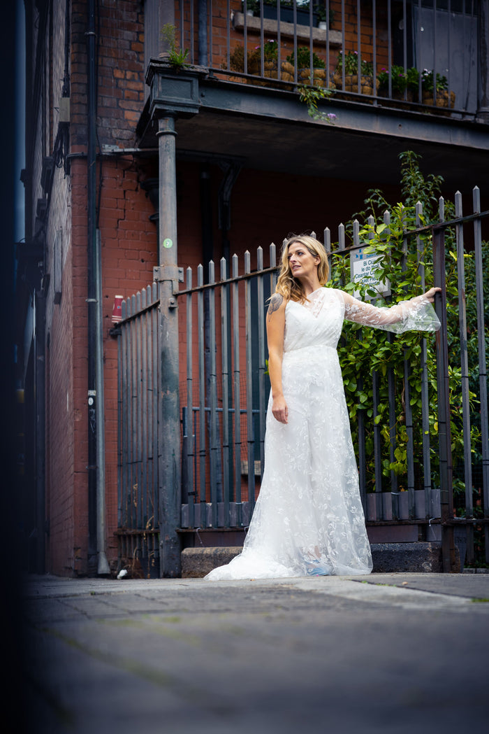 Irish bride wears a one shoulder lace wedding dress in Dublin 