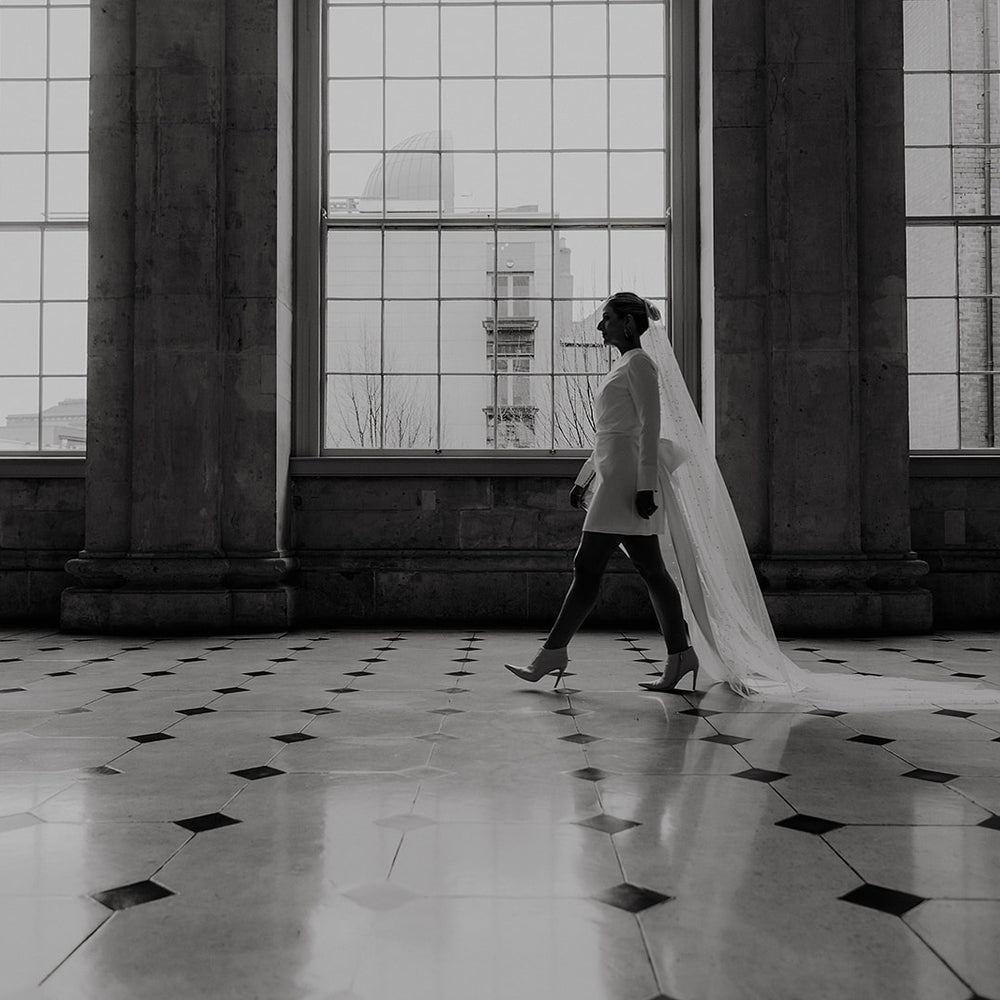 Irish Bride wears a short wedding dress with LONG SLEEVES AND STATEMENT BOW IN cORK 