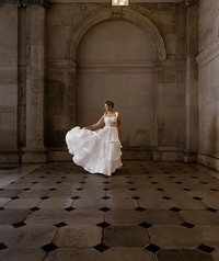 Irish bride wears sheet corset wedding dress with 3 tier pleated skirt in Galway 