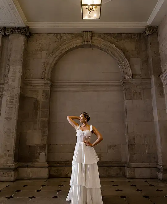 Irish bride wears sheet corset wedding dress with 3 tier pleated skirt in Galway 