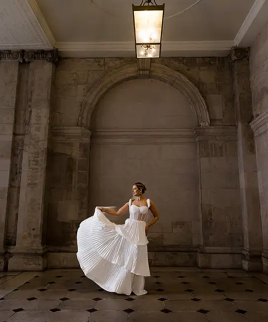 Irish bride wears sheet corset wedding dress with 3 tier pleated skirt in Galway 