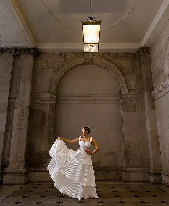 Irish bride wears sheet corset wedding dress with 3 tier pleated skirt in Galway 